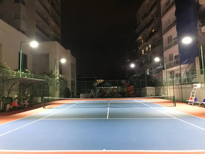 river garden - tennis court by night